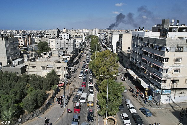 Families in cars, trucks and donkey carts packed with blankets and possessions streamed down a main road out of Gaza City