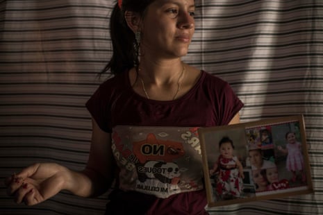 Yessica Yessenia Garcia Galindo, 24, Higinio Alberto’s wife, shows a family picture.