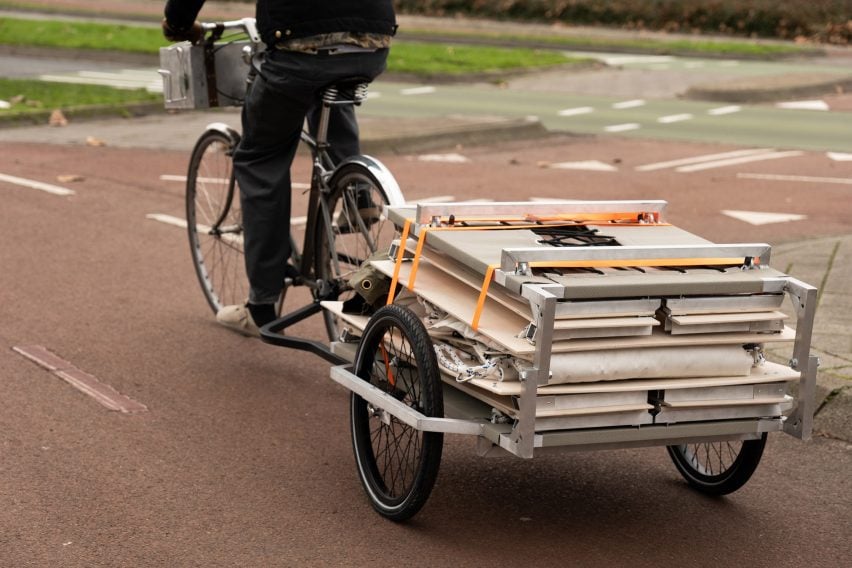 Trunk Bunk portable treehouse by Henry K Wein being towed by bicycle