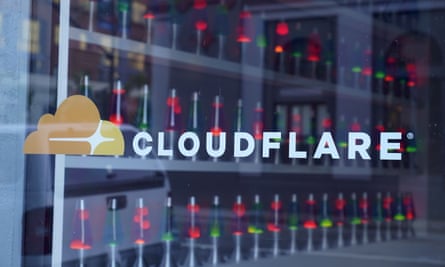 Cloudflare logo in front of a set of server racks