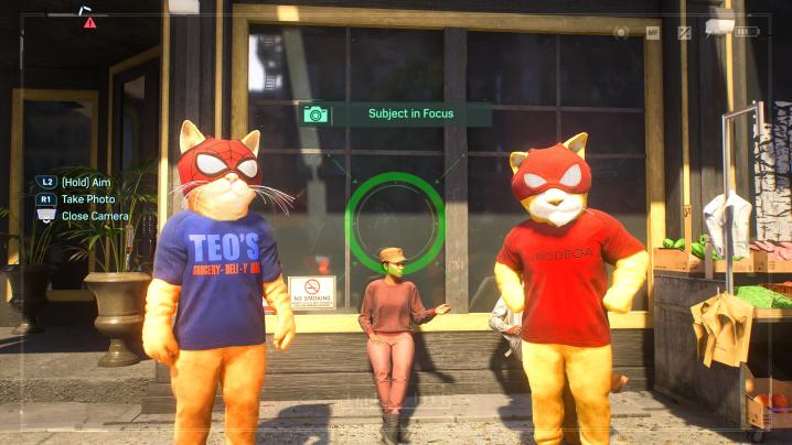 Two bodega cat spider-men mascots.