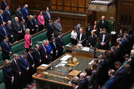 MPs standing during the minute’s silence in the Commons today.