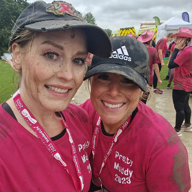 TOUGH STUFF: Katie (left) smiles alongside a friend after their muddy charity run earlier this year