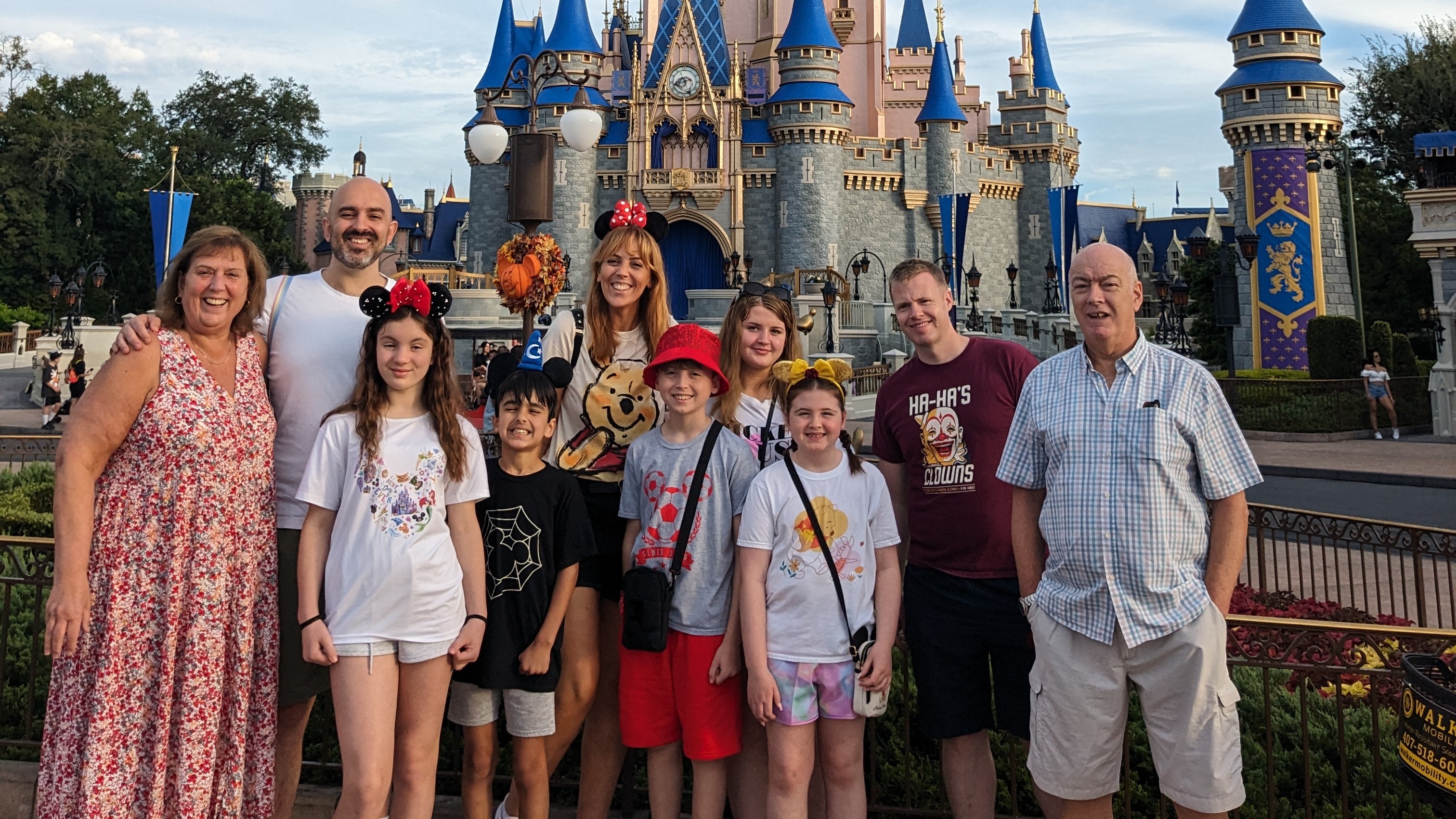 Mark and his family pose in from of the world-famous Cinderella castle