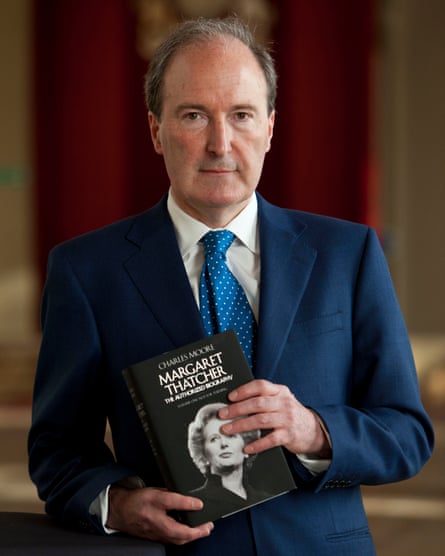 Charles Moore, holding his book about Margaret Thatcher