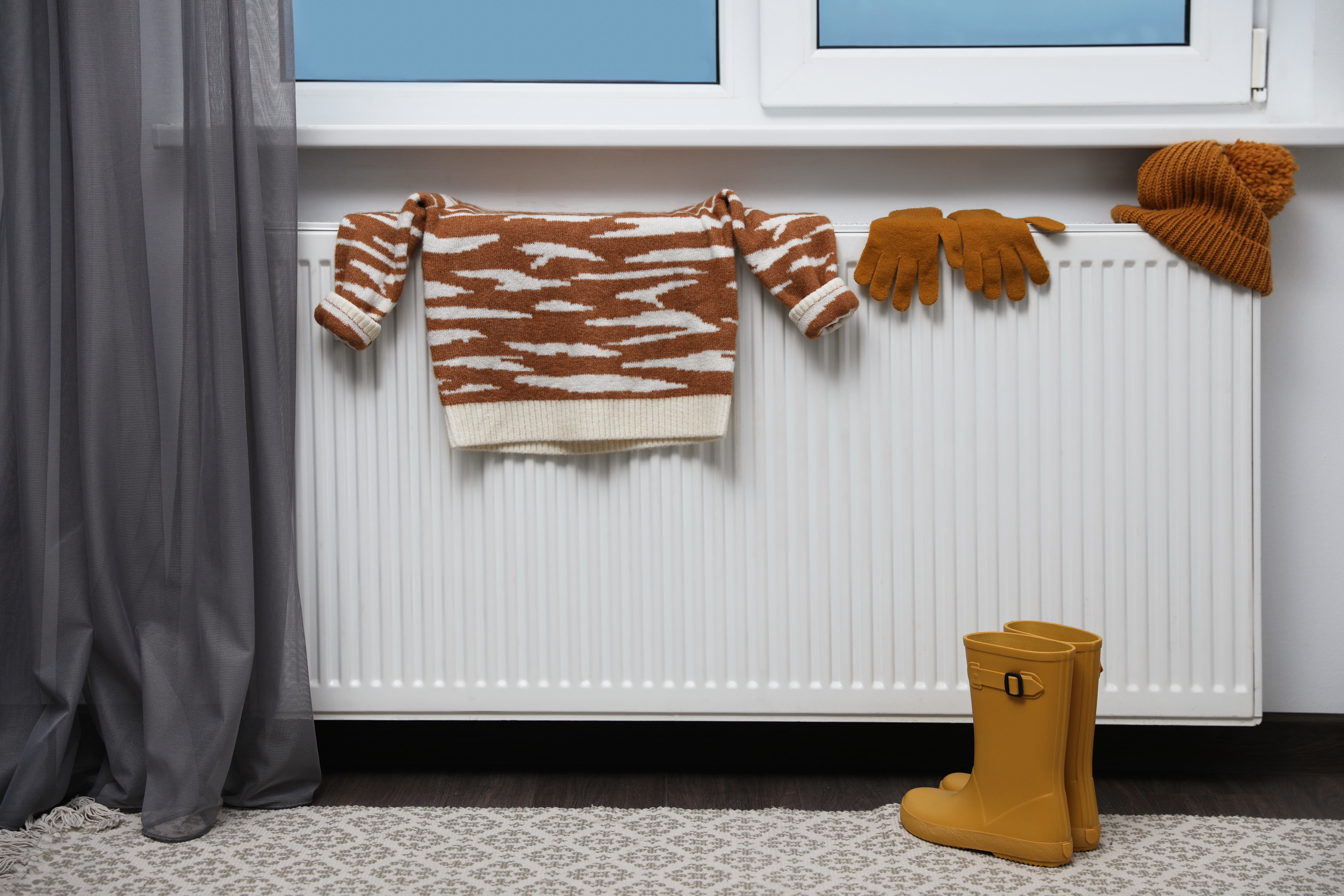 Wet clothes on hot radiators releases into the air, causing mould and damp