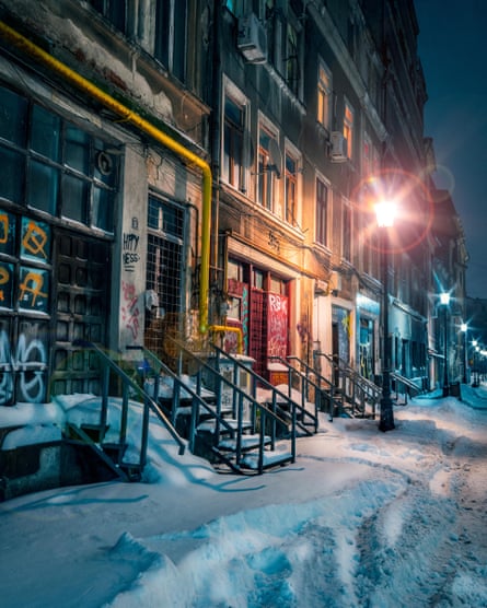 A snowy street in Bucharest in the evening.