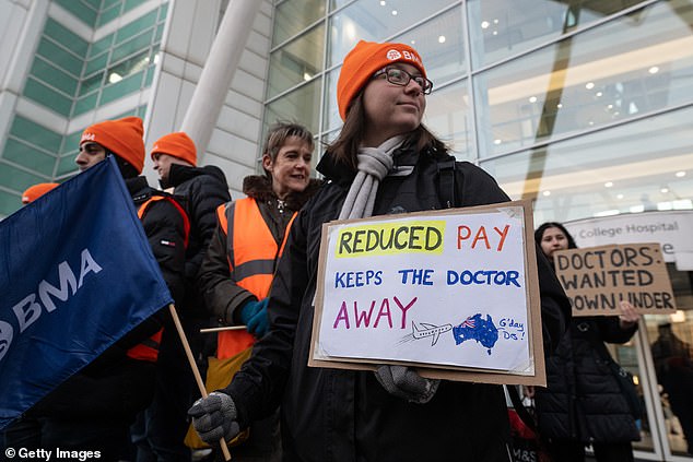 The BMA has claimed that junior doctors have seen their pay eroded by 35 per cent in real terms over the past 15 years. Pictured: Junior doctors striking outside University College Hospital in London on December 12