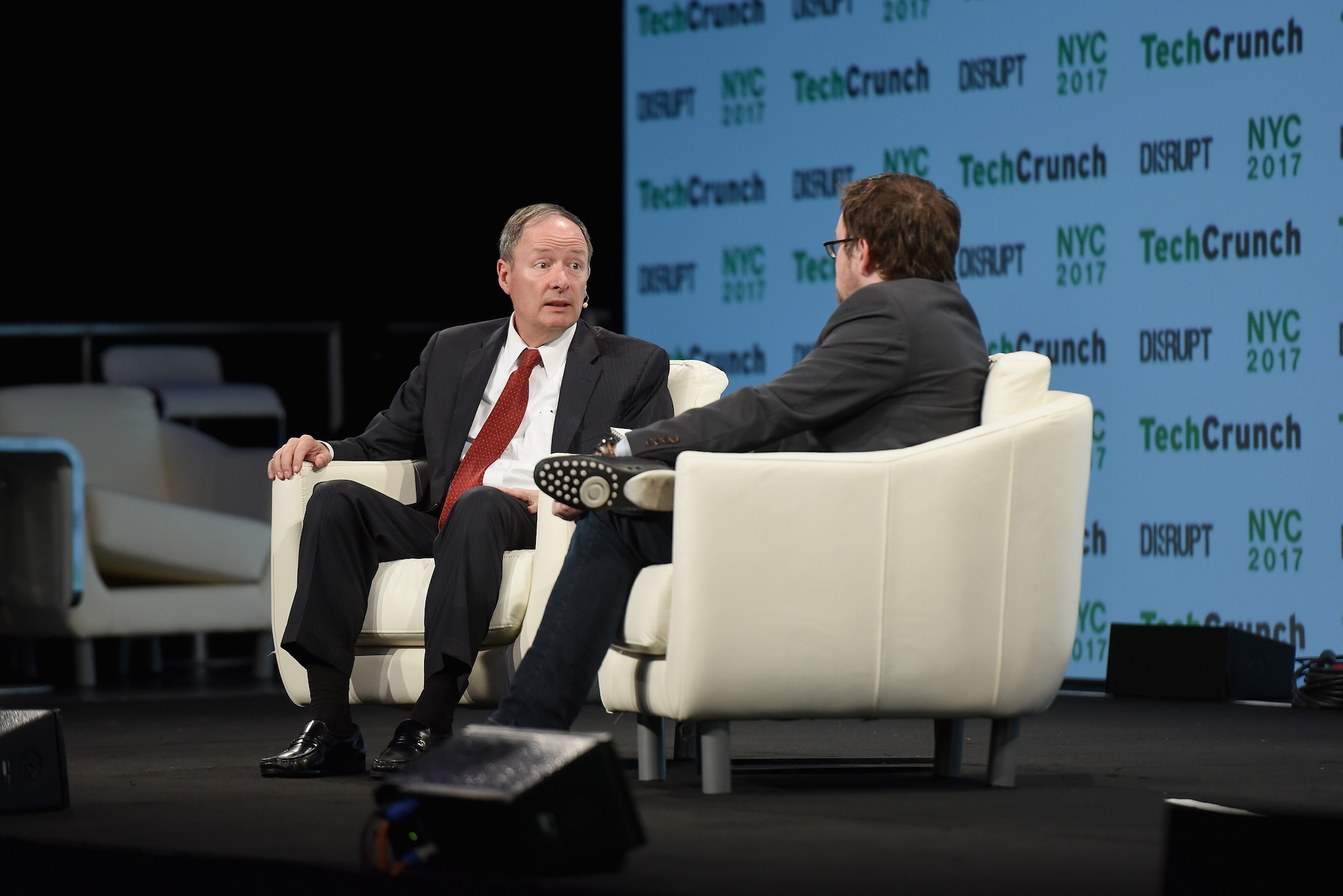 Keith Alexander on stage speaking to Matt Burns at TechCrunch Disrupt in 2017