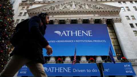 A banner for Athene Holding Ltd hangs on the facade of the New York Stock Exchange