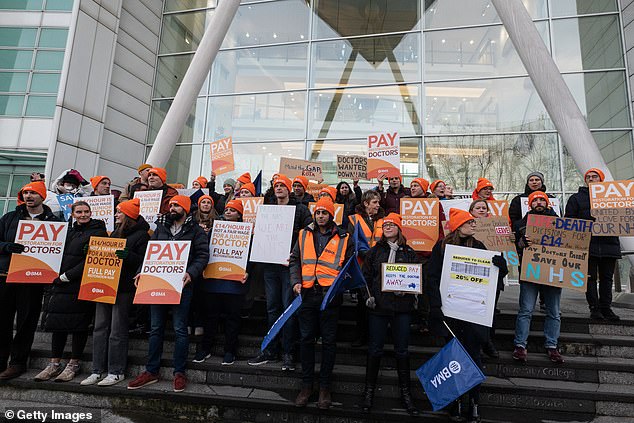 Junior doctors today kicked off their 26th day of industrial action this year. The action will end at 7am on Saturday before a further six-day strike — the longest in NHS history — begins at 7am on January 3. Pictured: Junior doctors striking outside University College Hospital in London on December 12