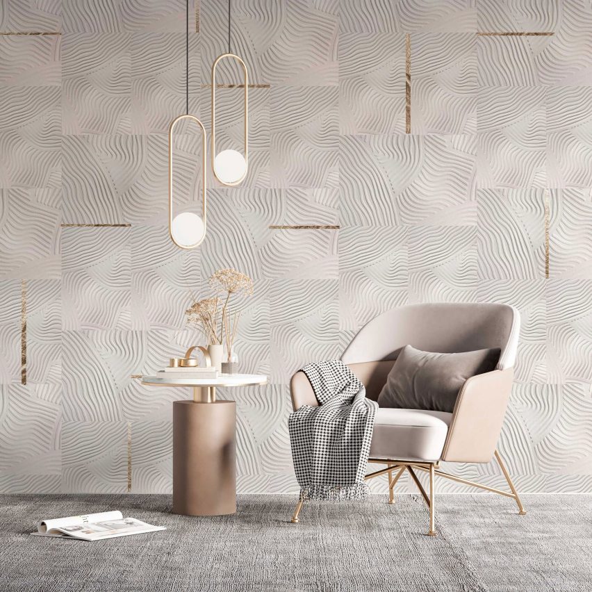 Armchair in front of wallpapered wall
