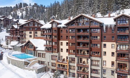 Accommodation and pool area at Les Terrasses d’Eos in Flaine, France on a sunny day,