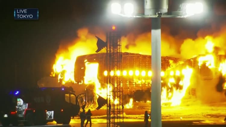 Japan Airlines aircraft in flames at Tokyo airport