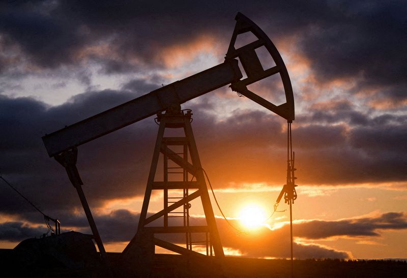 Oil settles lower on massive US fuel inventory builds
