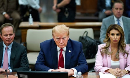Donald Trump sits at the defense table with his attorneys Christopher Kise, left, and Alina Habba in New York state supreme court on 7 December.