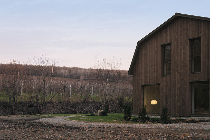 aging wood planks embrace the exterior of maison melba in quebec