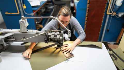 A sewing machine employee at work