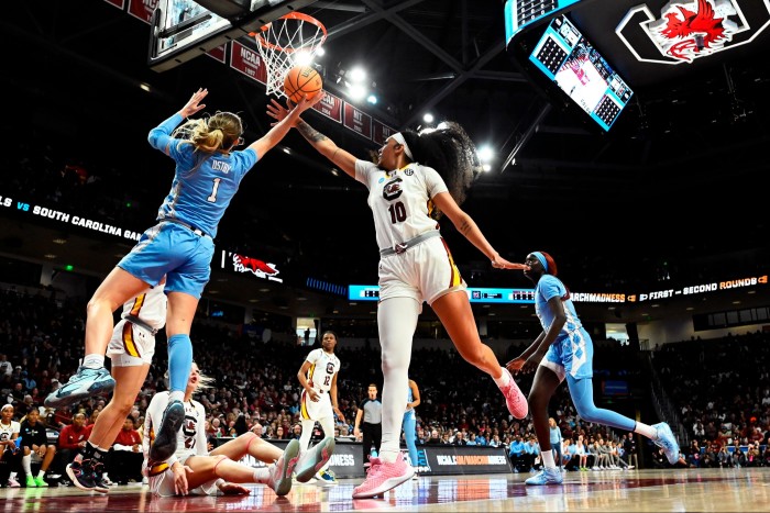 Alyssa Ustby of the North Carolina Tar Heels, and Kamilla Cardoso of the South Carolina Gamecocks, during an NCAA game