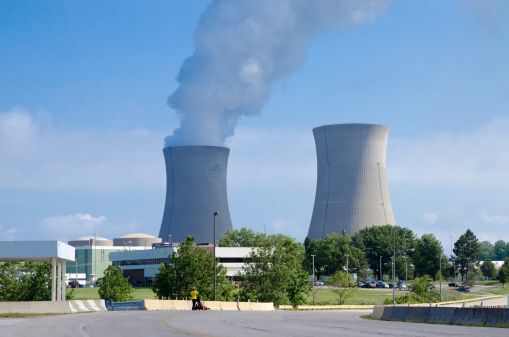 Two nuclear plants sending smoke in the atmosphere