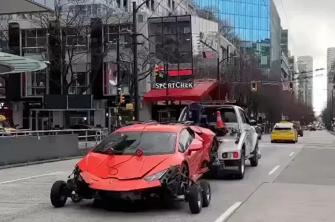 Footage showed the crashed supercar being towed away after the horror accident