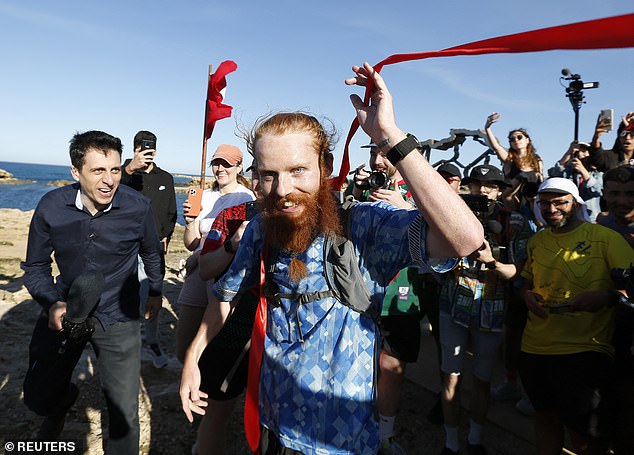 The secret to becoming a ultra-long-distance runner like Russ Cook is to train at a very high frequency at lower distances. Mr Cook (pictured) is believed to have run between 25-50 km (15-30 miles) every day for about a year in preparation