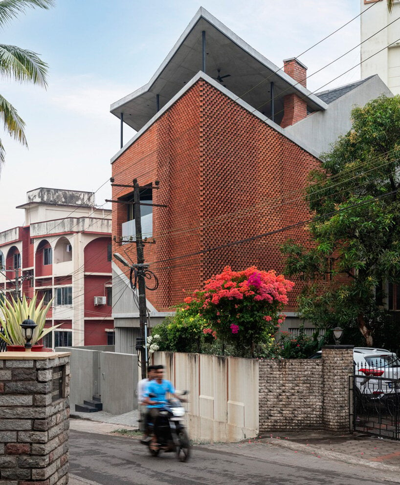 patterned brickwork enfolds multi-leveled residence by purple ink studio in india