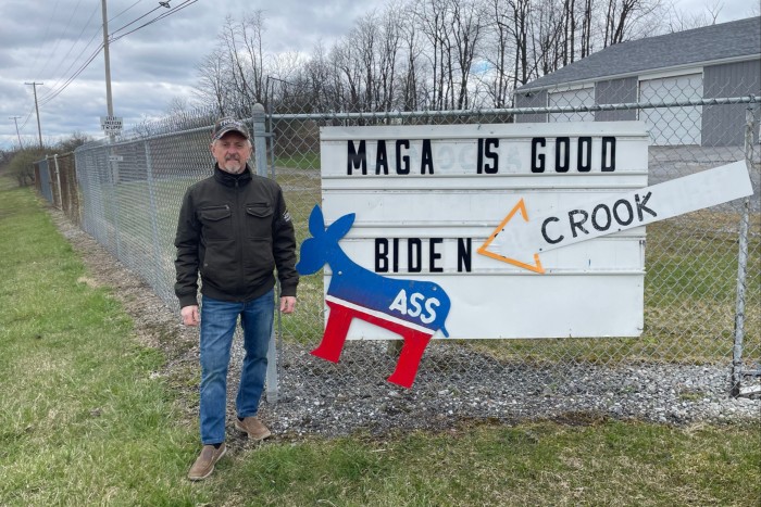Joe Cyran, a supporter of Donald Trump who owns a construction company, has placed campaign signs outside his business near Loretto, Pennsylvania