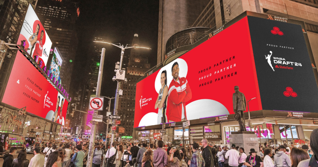 Jake from State Farm and Caitlin Clark on billboards in Times Square