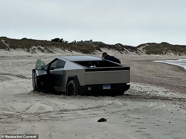 Cybertruck owners have previously complained about off-roading issues, reporting that the vehicle got stuck in the snow or had trouble getting up a hill. Pictured: Cybertruck stuck on Nantucket Island's beach