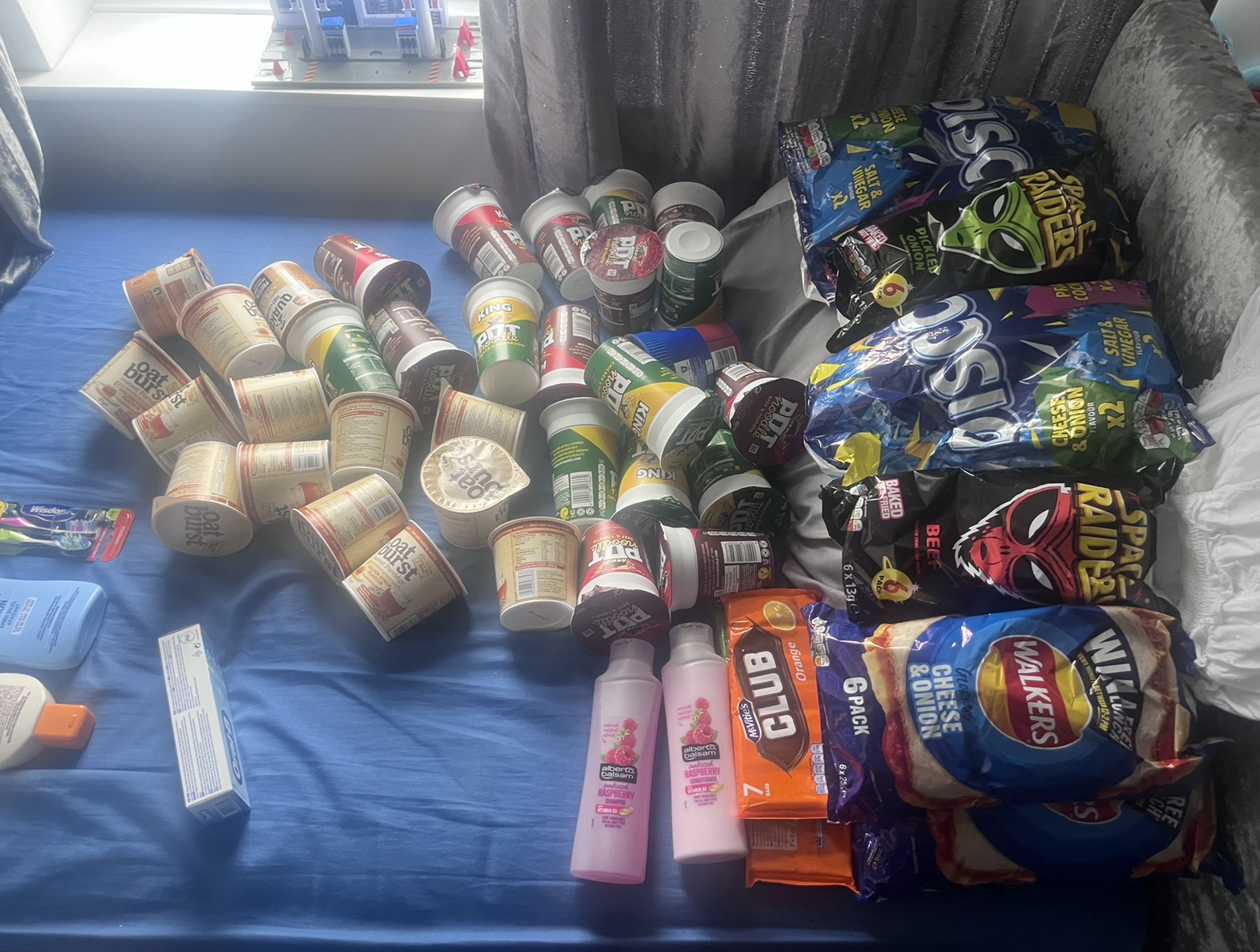 They took 86 bags of crisps, two packets of bacon, a pack of 30 sausages, cans of tuna, a block of cheese and brown sauce to Egypt