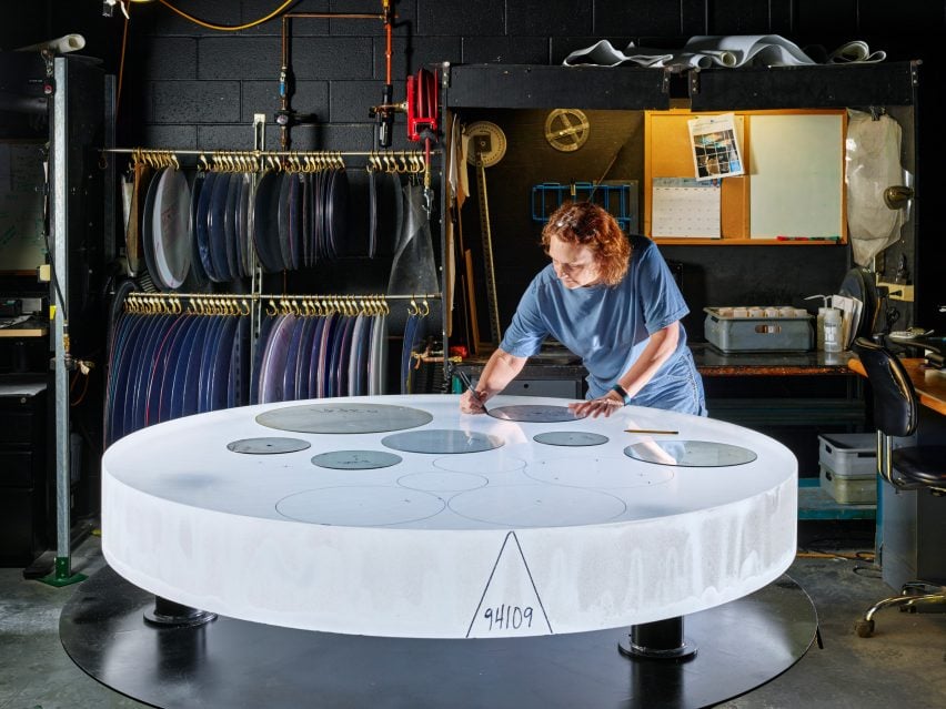 A skilled technician tracing a part template for optimized glass utilization on a boule of Corning HPFS Fused Silica. 