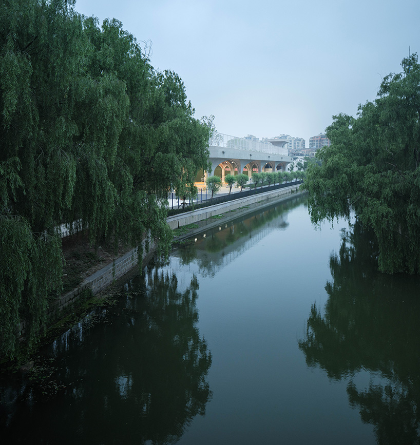 arched structural canopy outlines indoor sports field at shaoxing university in china by UAD