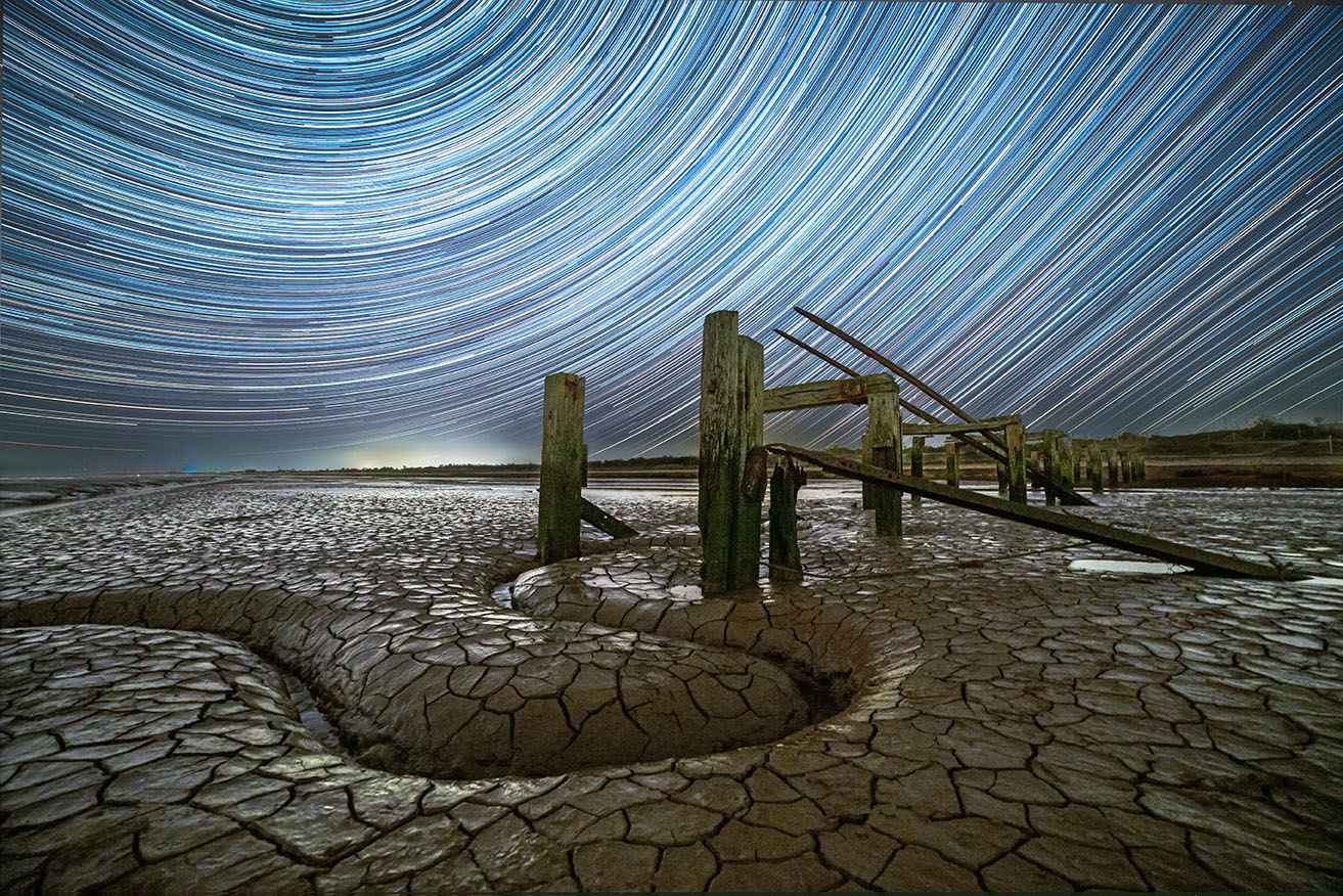 Trailing radial stars over mudflats