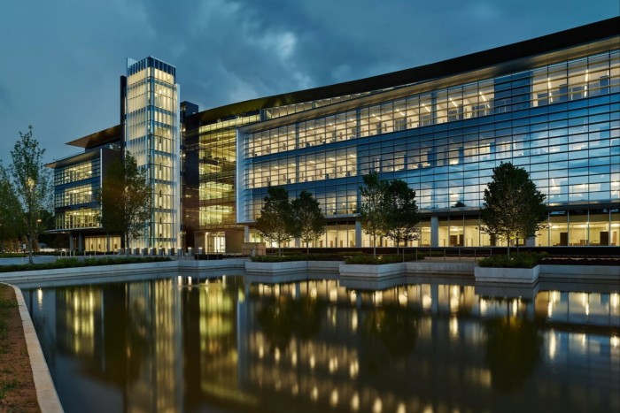 The building is shown at twilight