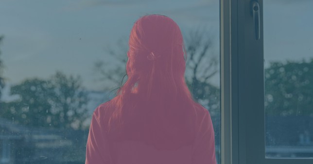 A girl looking out the window - she is all pink and outside is all blue