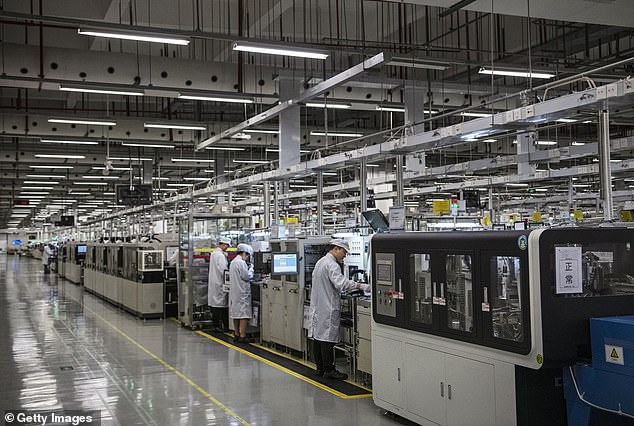 Workers are seen on the production line at Huawei's production campus on April 11, 2019 in Dongguan, near Shenzhen, China