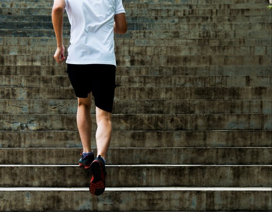 Man running up outdoor stairs