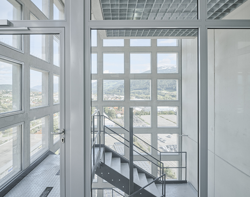 concrete crown by obsermoser + partner architekten transforms a 1978 grain silo into a storing-center for wood pellets