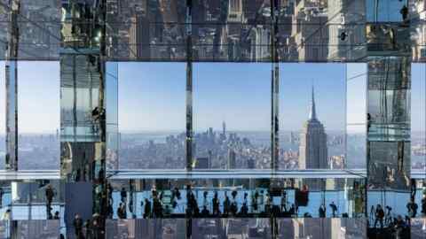 Attendees are reflected in mirrors during the grand opening of the One Vanderbilt observation deck in New York in October 2021