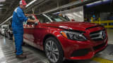 An employee does final inspections on a Mercedes-Benz C-Class at the Mercedes-Benz US International factory in Vance, Alabama.