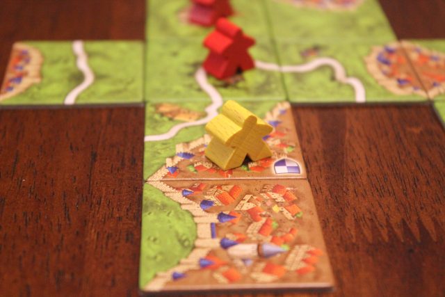 Game board and pieces for Carcassonne.