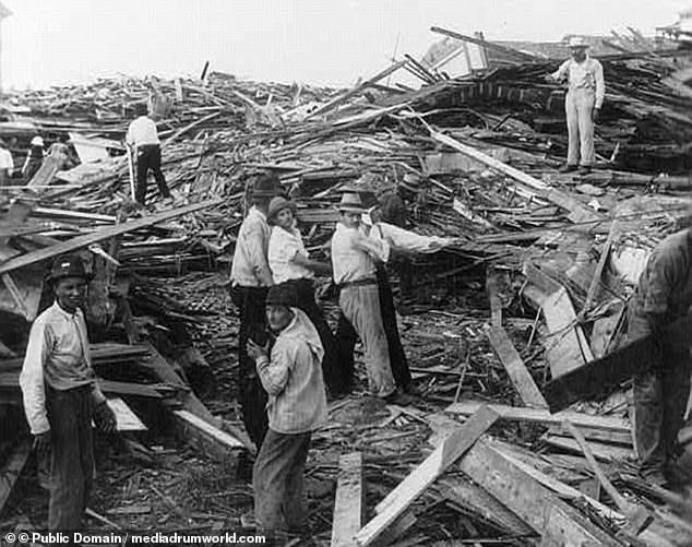 A disaster relief party search for bodies in the city that was once one of the wealthiest in Texas in 1900