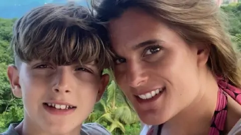 Ellen Roome Ellen Roome and her son Jools smiling as a picture is taken