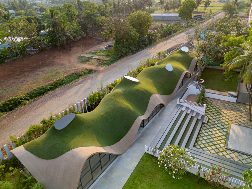 undulating green roof conceals cocoon pre-primary school in india mimicking a hillside