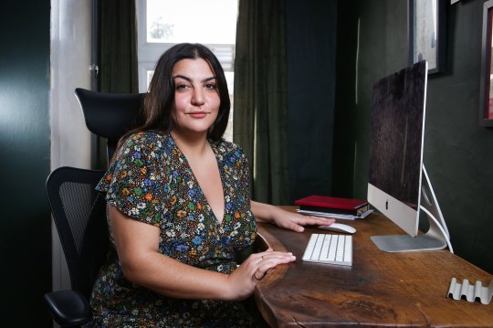 Almara Abgarian sitting at a desk with a computer at home