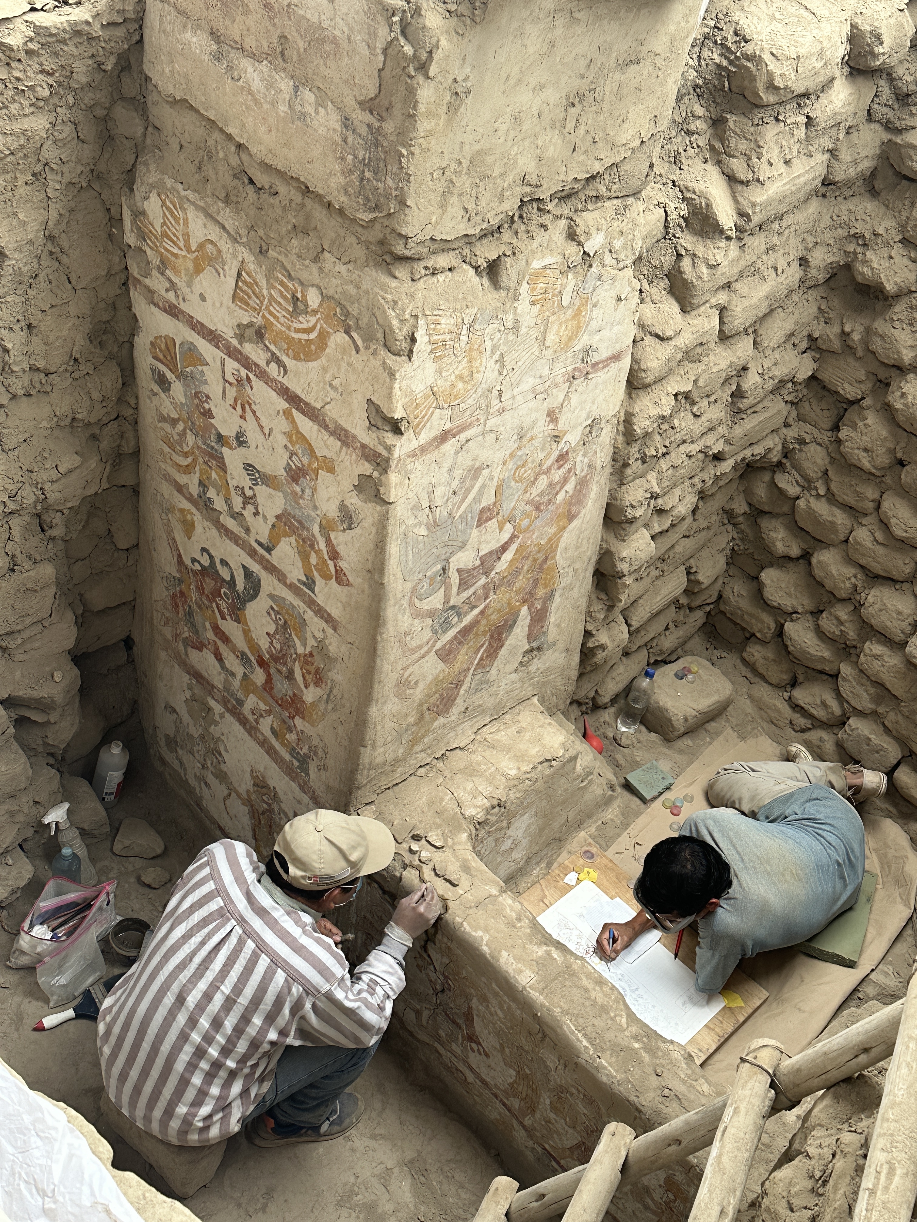 Two people in the ancient throne room.