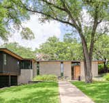 This smart renovation of a 1950s split-level Austin residence accommodated additional space for the owners without actually expanding the house’s footprint. Through strategic changes that required relatively minimal intervention, like realigned wall heights and a repurposed carport, the home now spans 3,000 square feet. The rear of the lush lot also has a 550-square-foot ADU.