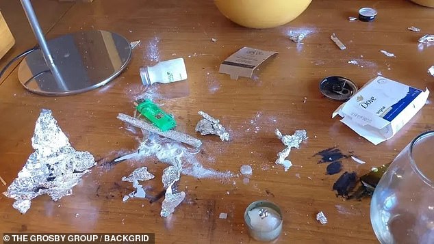The image shows a table in Payne's hotel room in Argentina, where he plunged from a third-story balcony to his death