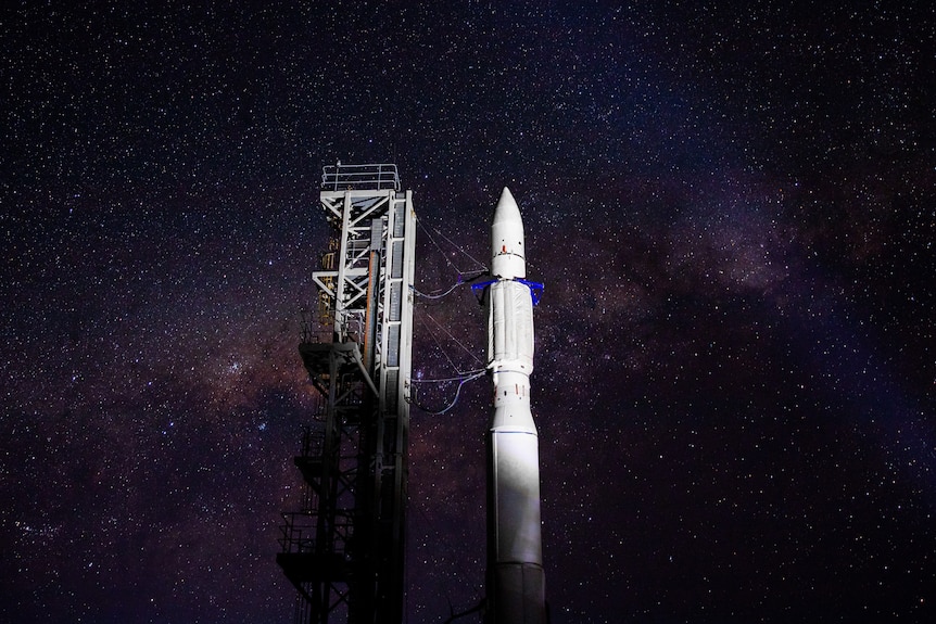 rocket in vertical position at night